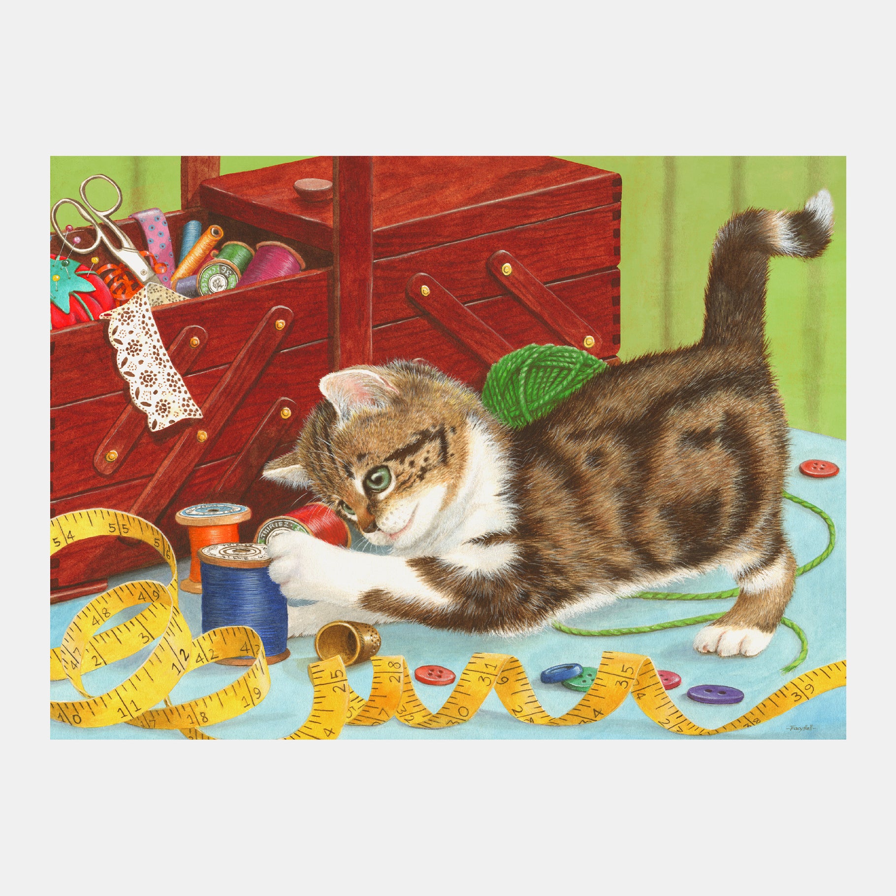 Kitten plays with sewing tools, ideal for dementia activities, gifts, and crafts for elderly in care homes.