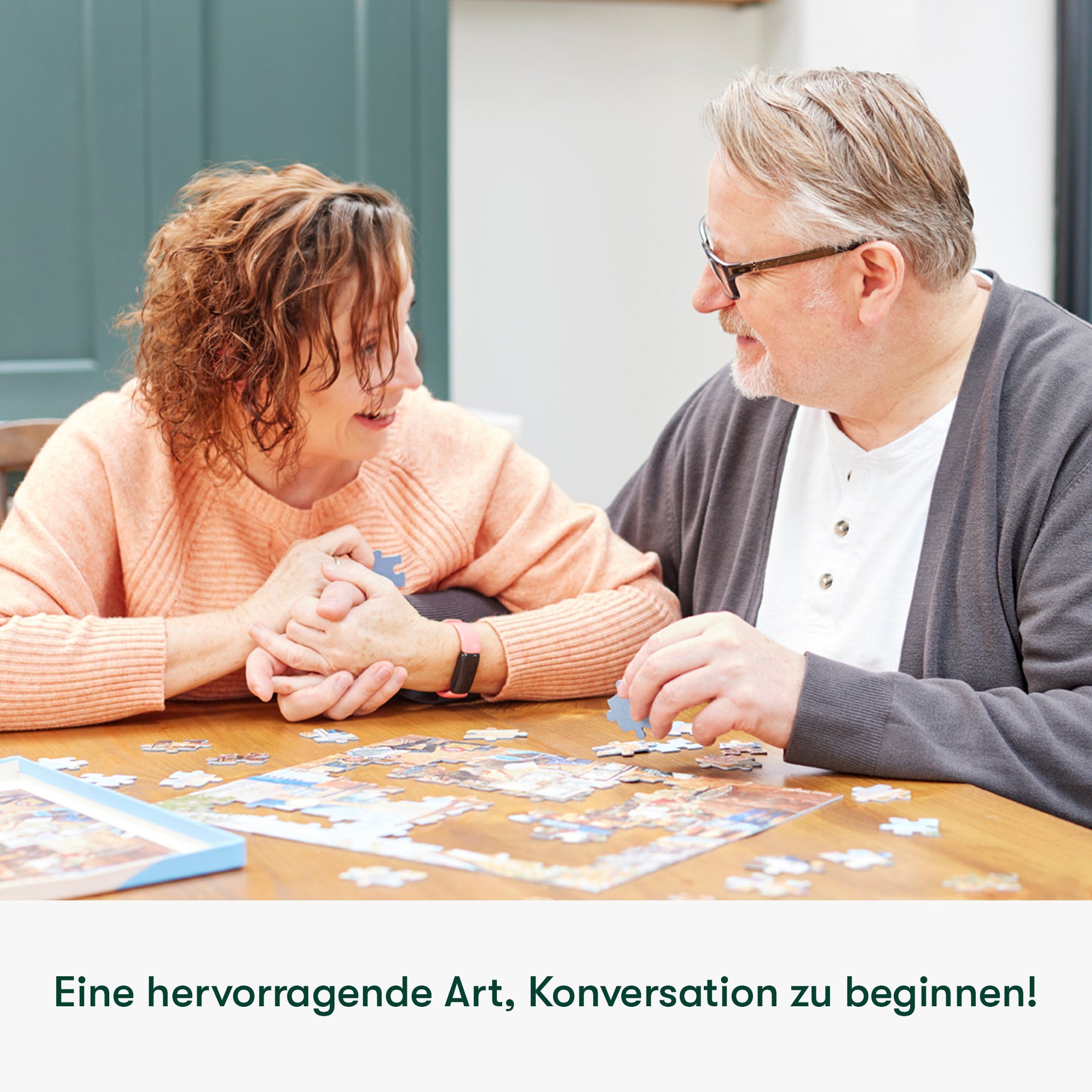Elderly couple enjoys a jigsaw puzzle, a dementia-friendly activity promoting connection and engagement in care homes.