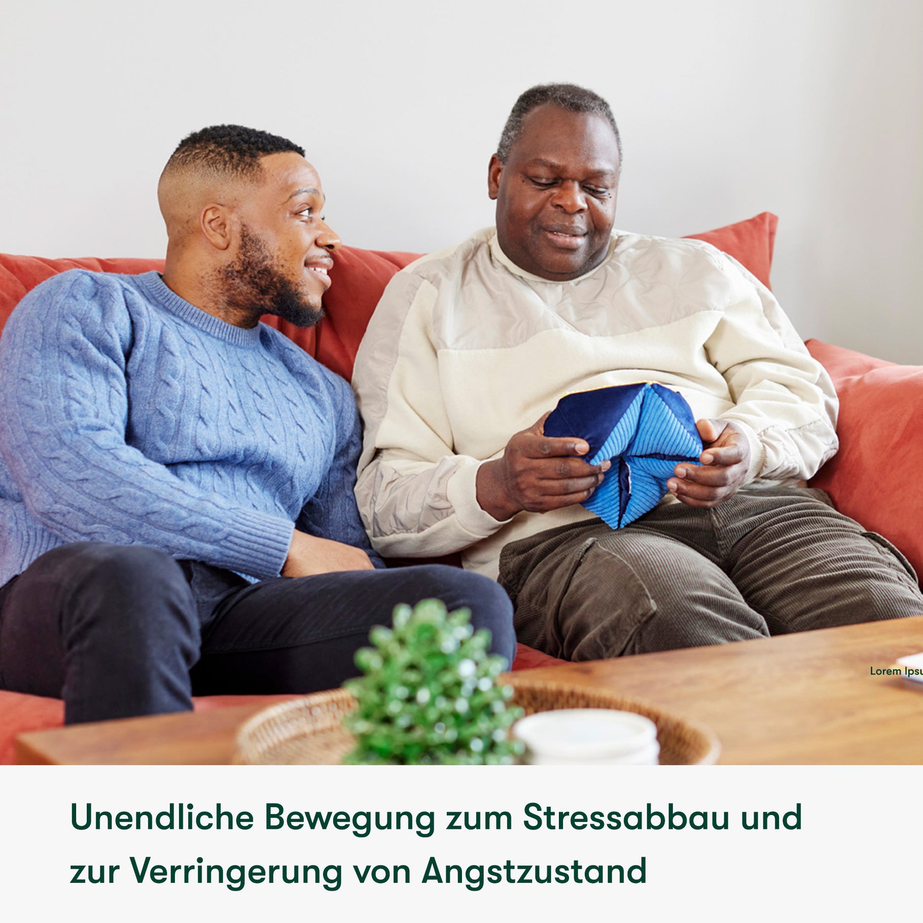 Elderly man with dementia uses a sensory toy, engaging in care home activities, fostering connection and calm with a caregiver.