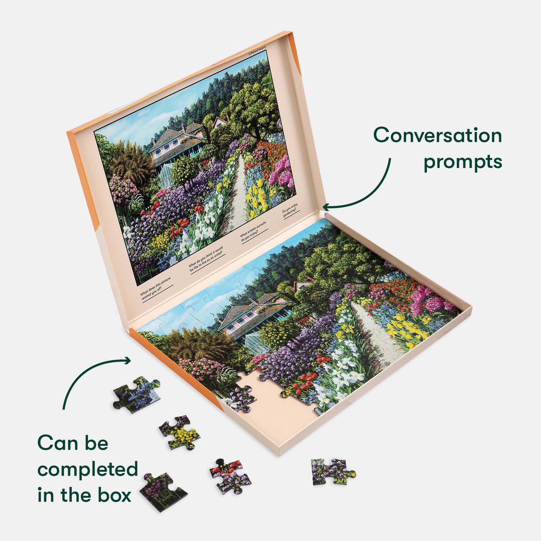 Puzzle with garden scenery and conversation prompts, designed for dementia engagement, shown partially assembled in its box.