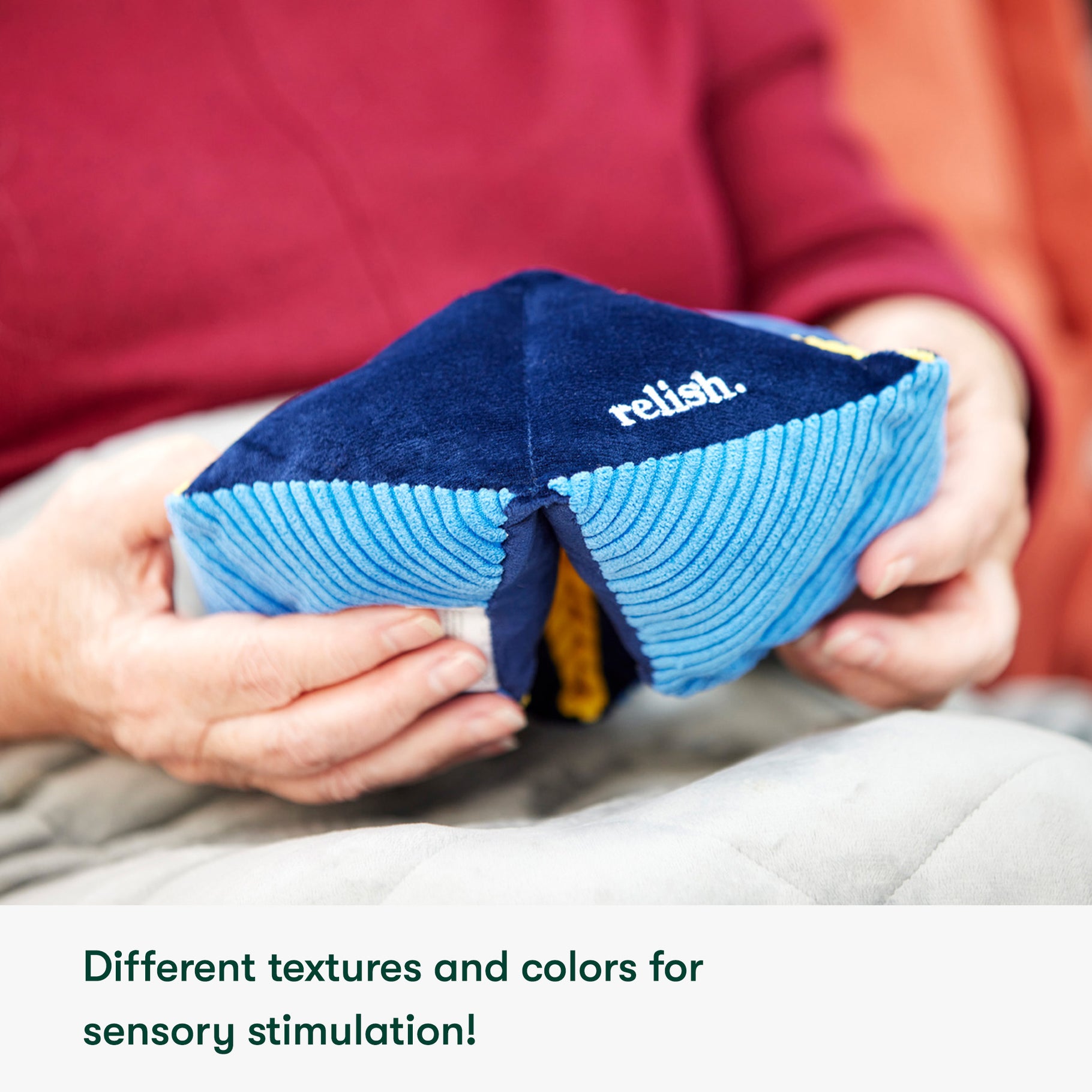 Hands holding a sensory toy for people living with dementia, ideal for care home activities and gifts for people with dementia.