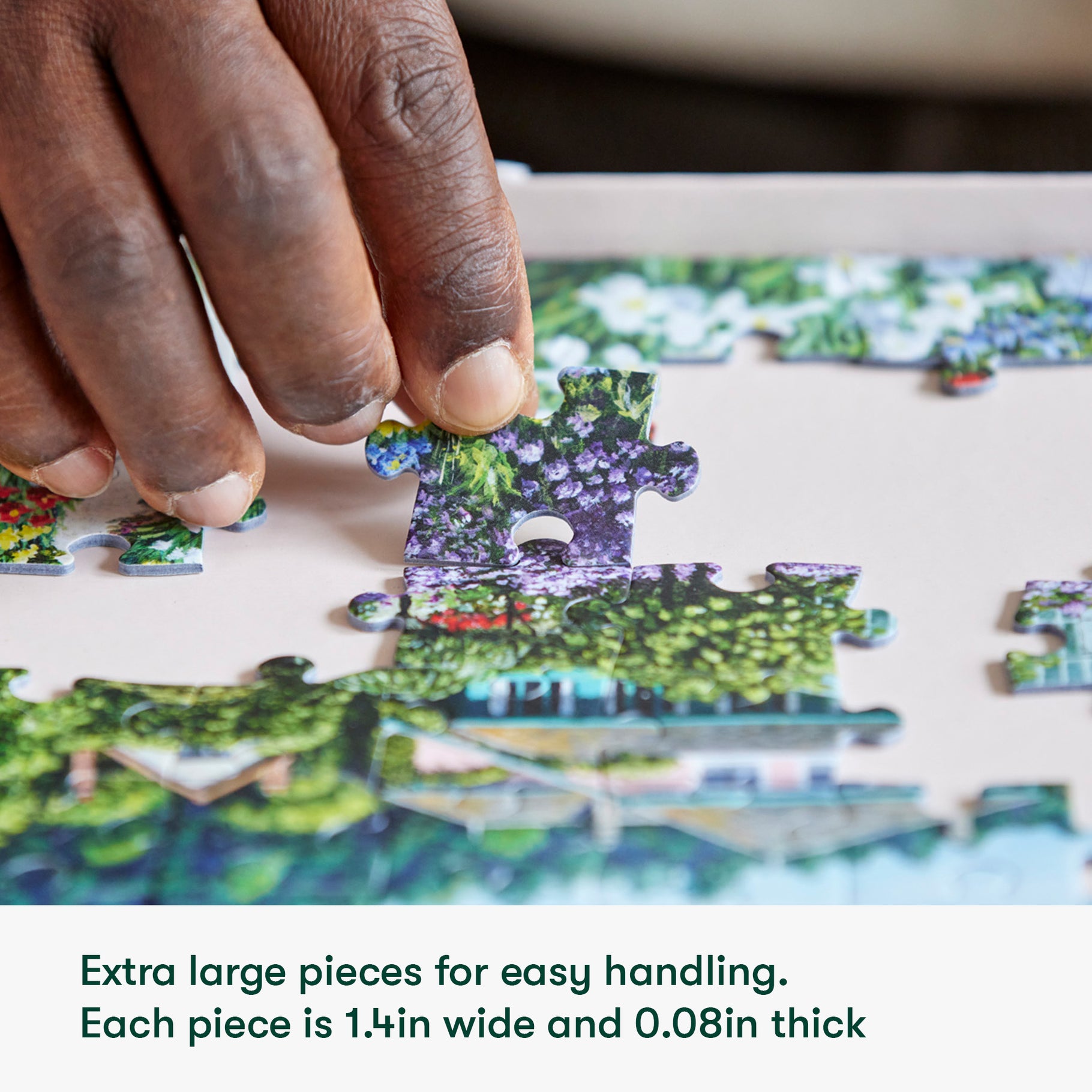 Hand placing large puzzle piece, ideal for dementia activities, enhancing engagement and cognitive function in care homes.
