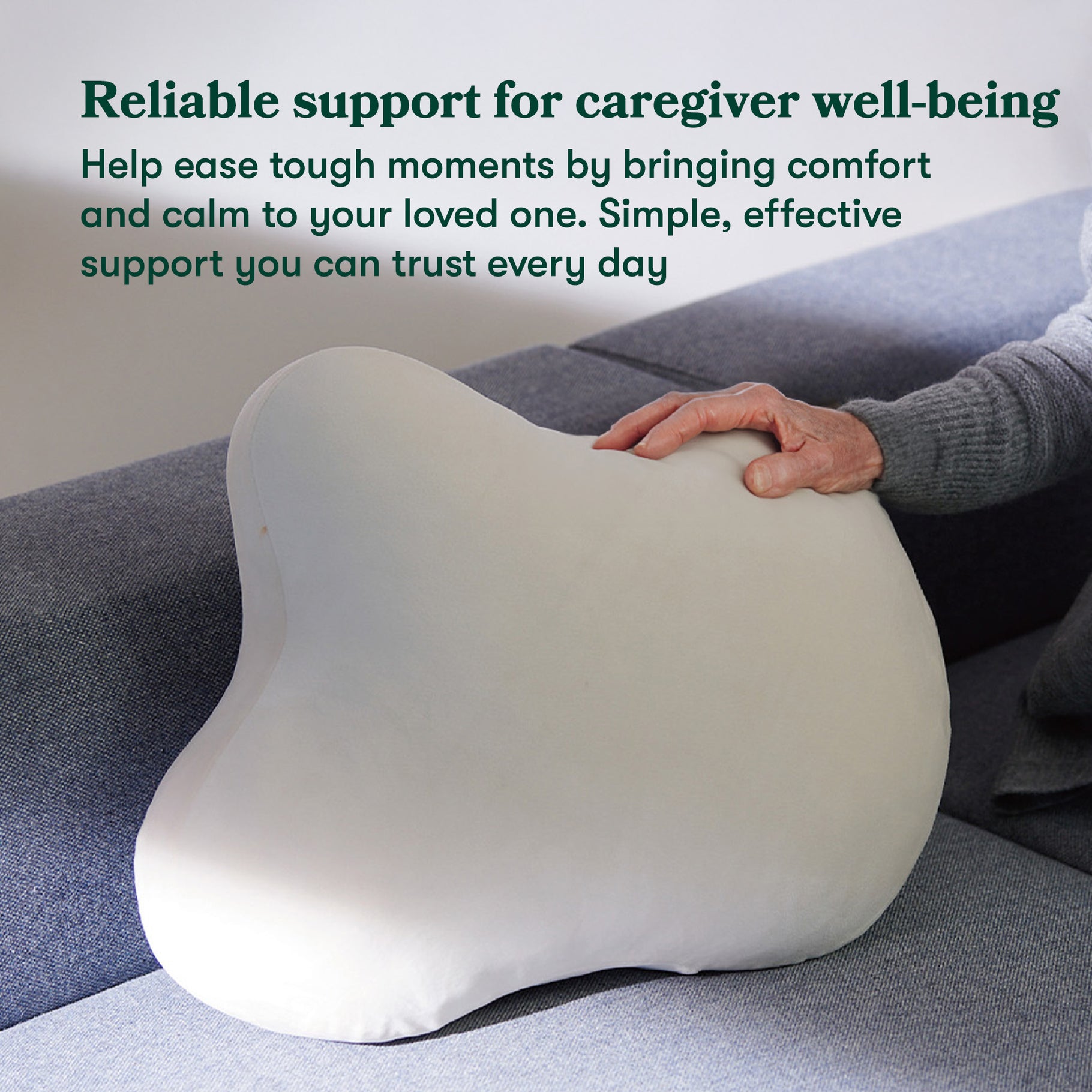 Hand resting on fufuly calming cushion.

Image caption: Reliable support for caregiver well-being. Help ease tough moments by bringing comfort and calm to your loved one. Simple, effective support you can trust every day