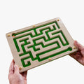 Hands holding a maze game, ideal for dementia activities, care home activities, and gifts for people with dementia.|market_au_ca_dk_fi_fr_international_ie_it_nl_pt_es_se_gb_us