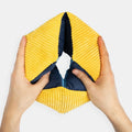 Hands holding a yellow and blue sensory toy, ideal for dementia activities, care home residents, and elderly engagement.|market_au_ca_dk_fi_fr_international_ie_it_nl_pt_es_se_gb_us