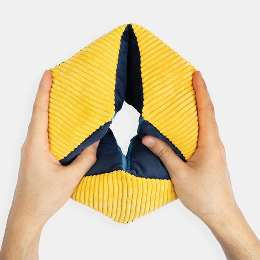 Hands holding a yellow and blue sensory toy, ideal for dementia activities, care home residents, and elderly engagement.|market_au_ca_dk_fi_fr_international_ie_it_nl_pt_es_se_gb_us