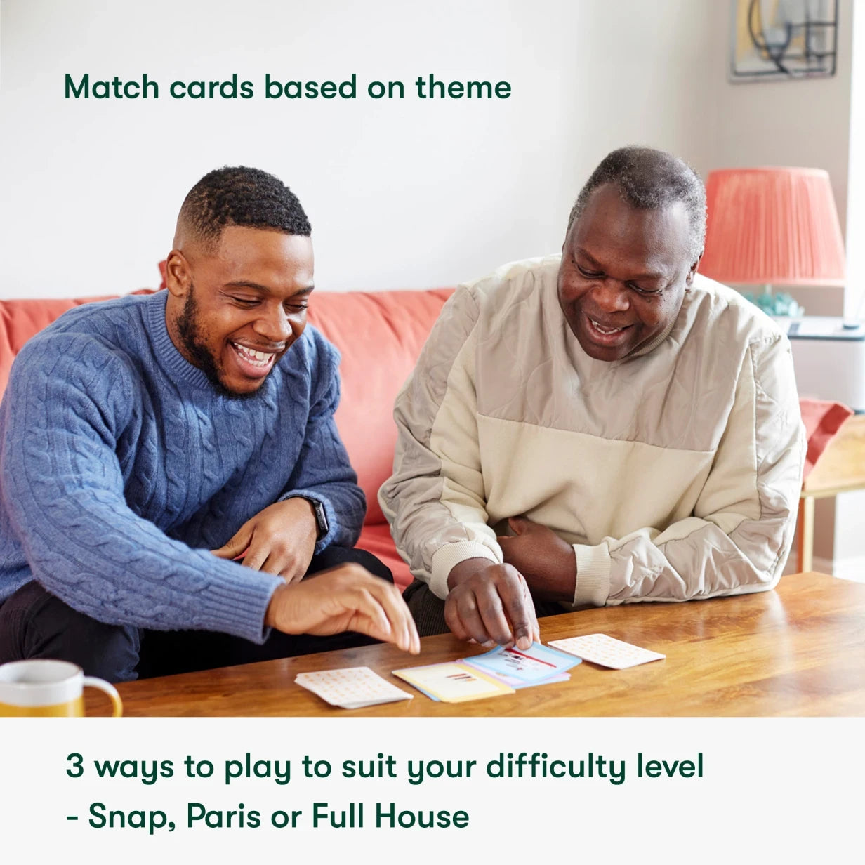 Two men enjoy card games, ideal activities for people living with dementia, promoting joy and engagement in care home settings.