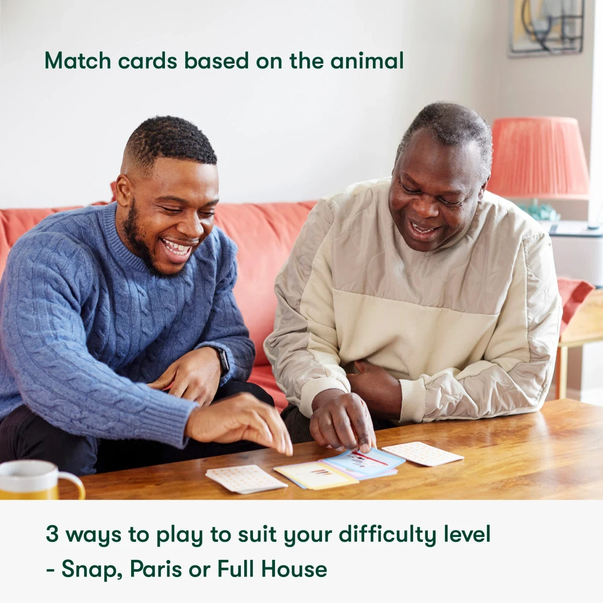 Two men enjoy a card game, ideal for dementia activities and care home residents, fostering connection and engagement.