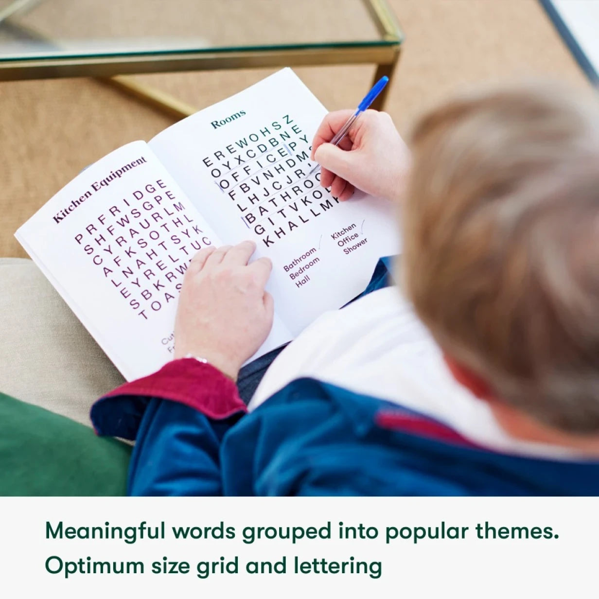 Elderly person solving a word search, ideal for dementia activities, care home activities, and gifts for people living with dementia.