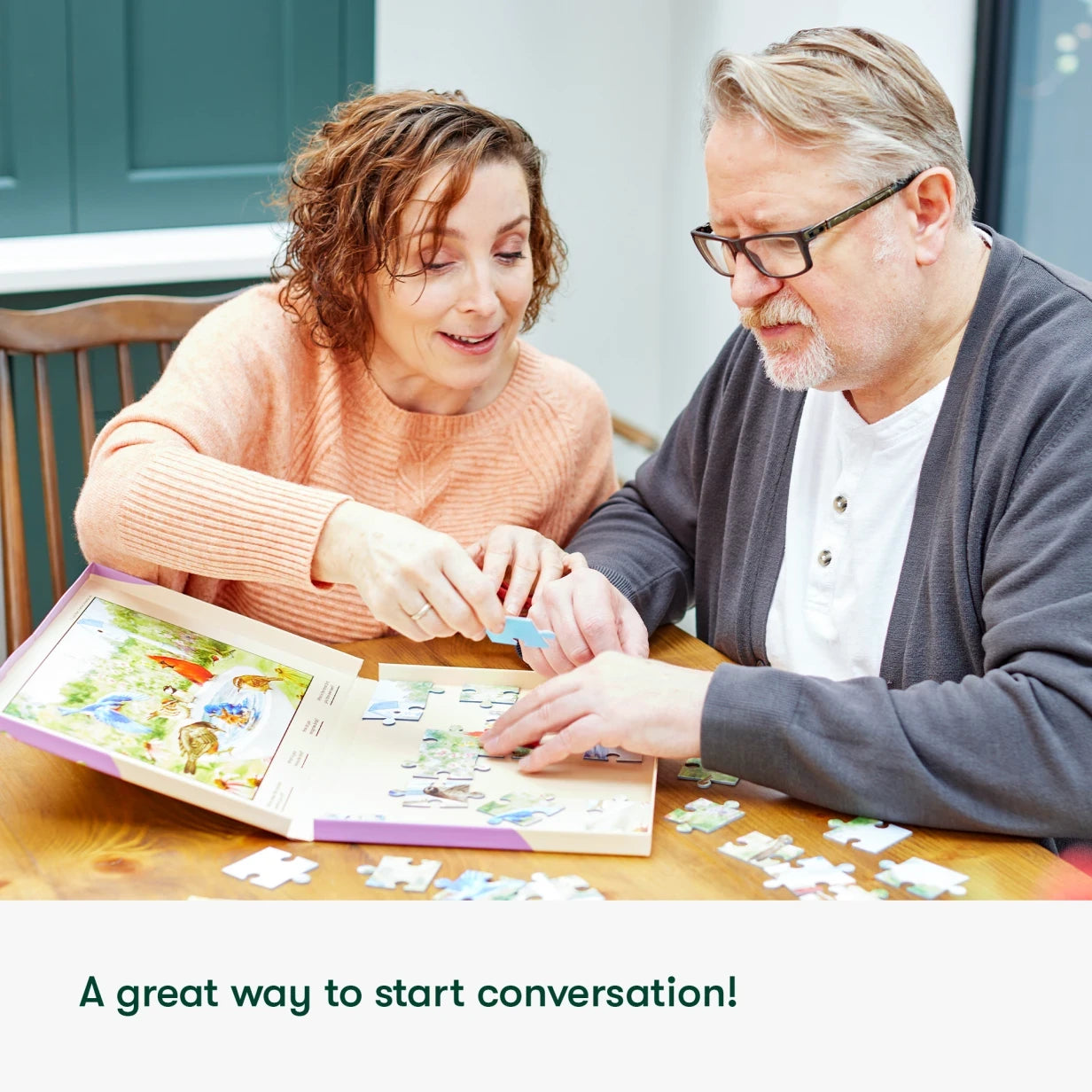 Elderly couple enjoys a dementia-friendly puzzle, perfect for care home activities and gifts for people with dementia.